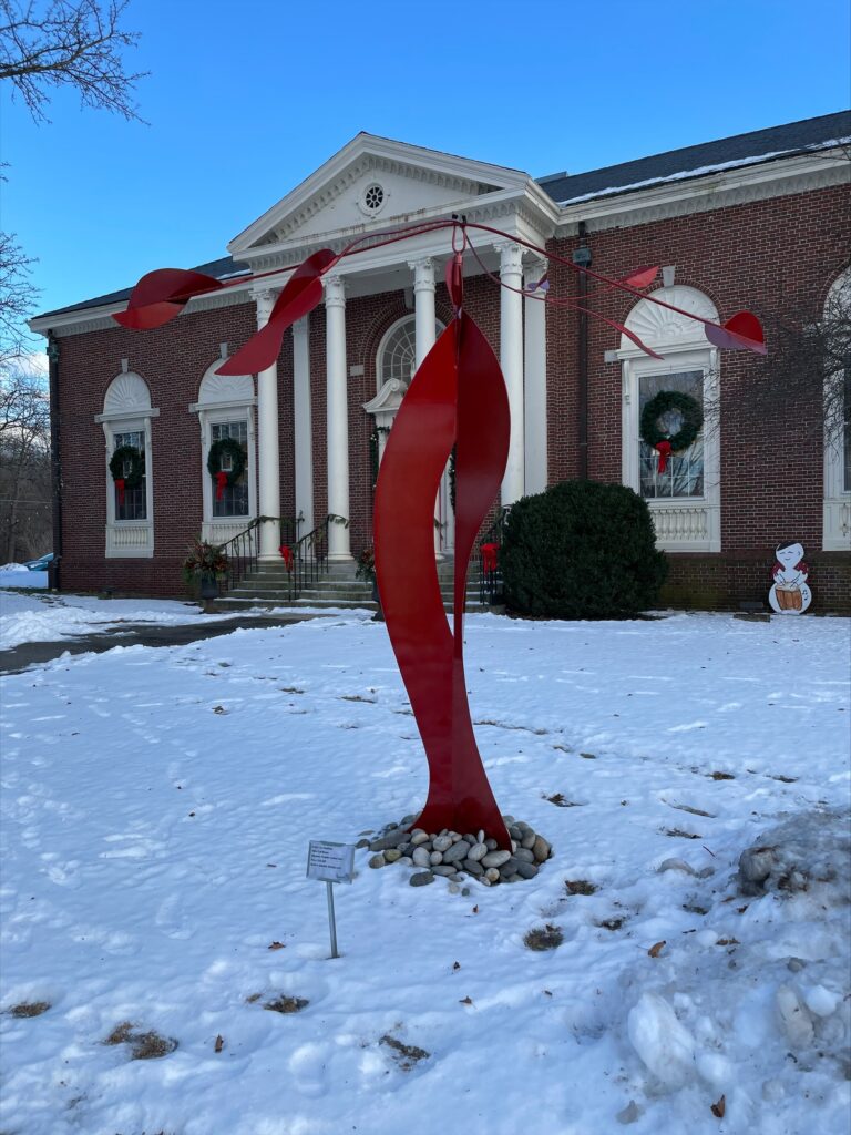 A photo of Jac Ouellette's "Full Bloom," located outside the Topsfield Town Library.