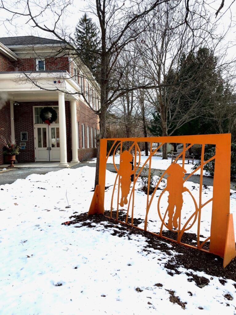 A photo of the sculpture "Piston" by James Meyer, outside the Topsfield Town Library.